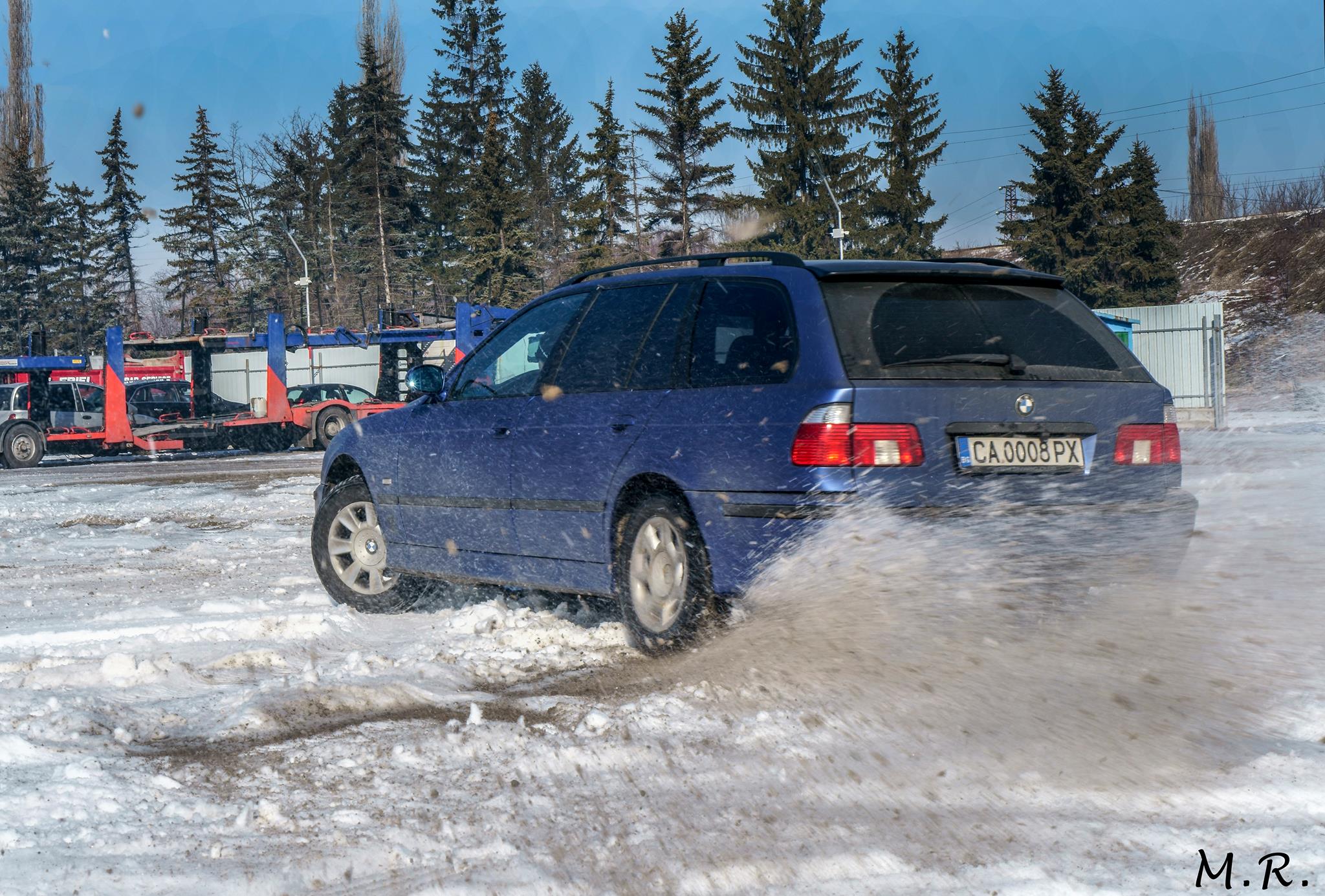car throwing snow